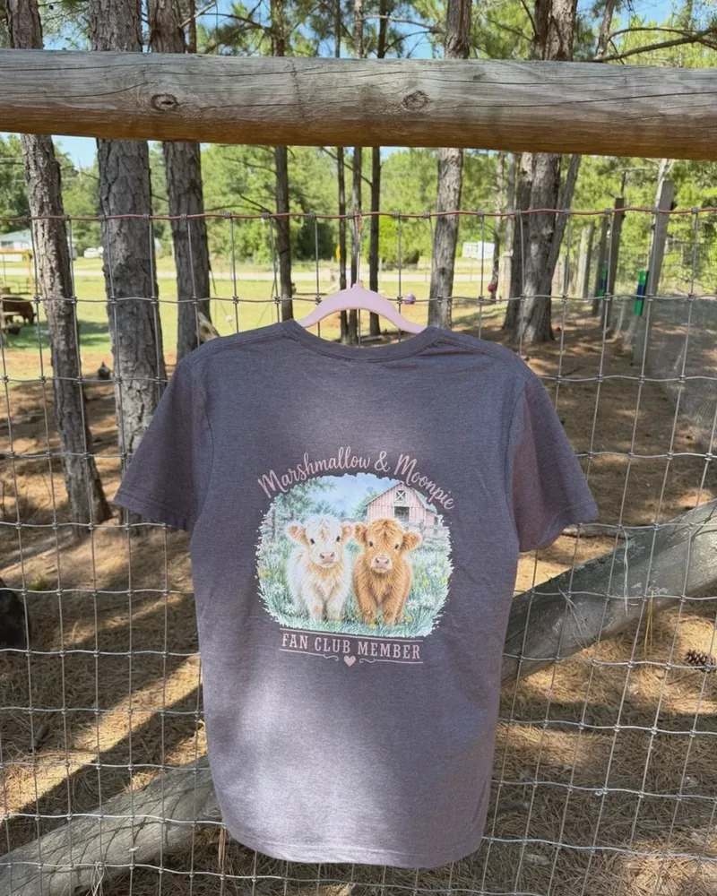 Grey Marshmallow and Moonpie Fan Club shirt hanging on the farm fence